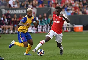 Arsenal's Eddie Nketiah Clashes with Colorado's Kellyn Acosta during the 2019-20 Pre-Season Match