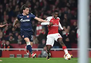 Arsenal V Red Star Belgrade 2017-18 Prints: Arsenal's Eddie Nketiah Clashes with Crvena Zvezda's Filip Stocjkovic in Europa League Showdown