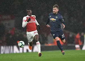 Arsenal V Manchester United 2018-19 Prints: Arsenal's Eddie Nketiah Clashes with Manchester United's Luke Shaw in Premier League Showdown