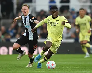 Arsenal's Eddie Nketiah Clashes with Newcastle's Sean Longstaff in Premier League Showdown