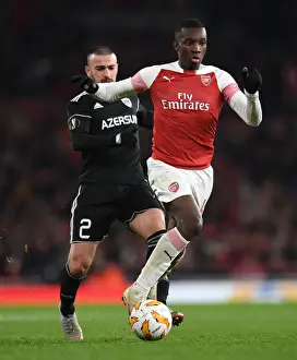 Arsenal V Qarabag 2018-19 Prints: Arsenal's Eddie Nketiah Clashes with Qarabag's Gara Gareyev in Europa League Showdown