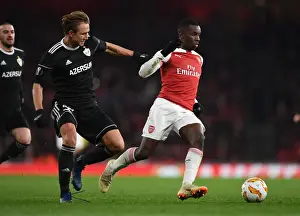 Arsenal V Qarabag 2018-19 Prints: Arsenal's Eddie Nketiah Clashes with Qarabag's Jakub Rzezniczak in Europa League Showdown
