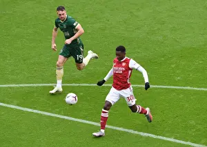 Arsenal's Eddie Nketiah Clashes with Sheffield United's Jack Robinson in Premier League Showdown