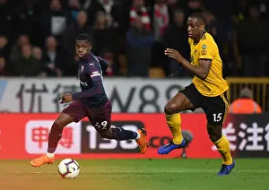 Wolverhampton Wanderers V Arsenal 2018-19 Prints: Arsenal's Eddie Nketiah Clashes with Wolves Willy Boly in Intense Premier League Showdown (2018-19)
