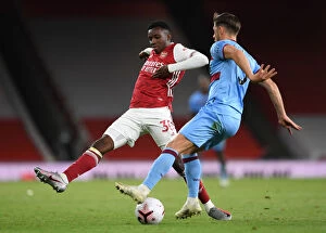 Arsenal v West Ham United 2020-21 Collection: Arsenal's Eddie Nketiah Closes In on West Ham's Aaron Creswell in Intense Arsenal v West Ham