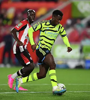 Brentford V Arsenal - Carabao Cup 2023-24 Prints: Arsenal's Eddie Nketiah Faces Off Against Brentford in Carabao Cup Clash