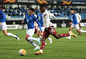 Molde FK V Arsenal 2020-21 Prints: Arsenal's Eddie Nketiah Faces Off Against Molde's Henry Wingo in Europa League Clash