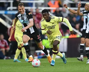 Newcastle United V Arsenal 2021-22 Prints: Arsenal's Eddie Nketiah Faces Off Against Newcastle's Dan Burn in Premier League Clash