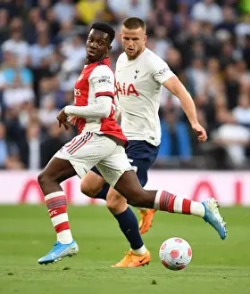Tottenham Hotspur V Arsenal 2021-22 Prints: Arsenal's Eddie Nketiah Faces Off Against Tottenham's Eric Dier in Intense Premier League Clash