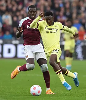 West Ham United V Arsenal 2021-22 Prints: Arsenal's Eddie Nketiah Faces Off Against West Ham's Kurt Zouma in Premier League Clash