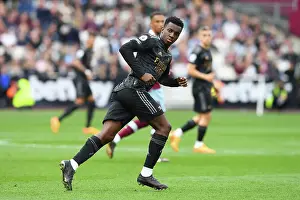 West Ham United V Arsenal 2022-23 Prints: Arsenal's Eddie Nketiah Focuses Ahead Amidst West Ham Battle (Premier League 2022-23)