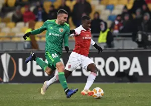 FC Vorskla Poltava V Arsenal 2018-19 Prints: Arsenal's Eddie Nketiah Goes Head-to-Head with Ardin Dallku in UEFA Europa League Clash