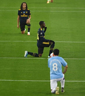 Manchester City v Arsenal 2019-20 Collection: Arsenal's Eddie Nketiah Kneels Before Manchester City Match, Premier League 2019-2020