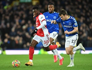 Everton v Arsenal 2020-21 Collection: Arsenal's Eddie Nketiah Outmaneuvers Everton's Seamus Coleman in Premier League Clash