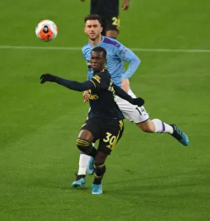 Manchester City V Arsenal 2019-20 Prints: Arsenal's Eddie Nketiah Outmaneuvers Man City's Aymeric Laporte in Premier League Clash