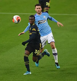 Manchester City V Arsenal 2019-20 Prints: Arsenal's Eddie Nketiah Outmaneuvers Manchester City's Aymeric Laporte in Premier League Clash