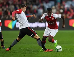 Sydney Western Wanderers V Arsenal 2017-18 Prints: Arsenal's Eddie Nketiah Outmaneuvers Rory Bonevacia: A Shining Moment in Sydney