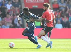 Arsenal's Eddie Nketiah Outmaneuvers Southampton's Lyanco in Premier League Clash