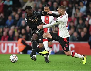 Southampton V Arsenal 2022-23 Prints: Arsenal's Eddie Nketiah Outmaneuvers Southampton's Lyanco in Premier League Clash