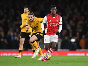 Arsenal's Eddie Nketiah Outmaneuvers Wolves Ruben Neves in Premier League Clash
