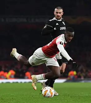 Arsenal V Qarabag 2018-19 Prints: Arsenal's Eddie Nketiah Tripped by Qarabag's Maksin Medvedev during Europa League Clash