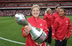 Arsenal v Swansea City 2011-12 Collection: Arsenal's Ellen White Celebrates WSL Title with Trophy Amidst Arsenal's 1
