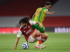 Arsenal's Elneny Fights for Possession Amid Empty Emirates: Arsenal vs. West Bromwich Albion (2020-21)