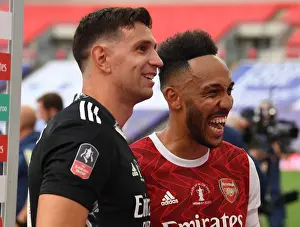 Arsenal's Emi Martinez and Pierre-Emerick Aubameyang Celebrate FA Cup Victory Amidst Empty Wembley Stadium
