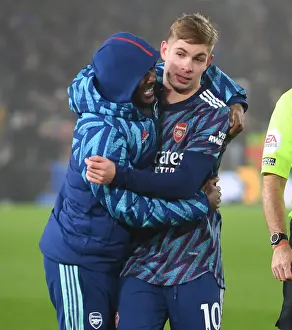 Arsenal's Emile Smith Rowe and Ainsley Maitland-Niles Celebrate Goal in Leeds United vs Arsenal (2021-22)