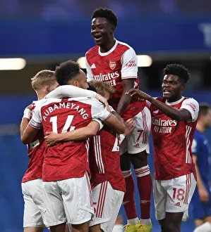 Arsenal's Emile Smith Rowe, Aubameyang, Saka, and Partey Celebrate Goal Against Chelsea in Empty Stamford Bridge (2020-21 Premier League)