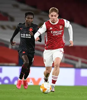 Arsenal's Emile Smith Rowe Breaks Past Slavia Praha's Oscar Dorley in UEFA Europa League Quarterfinal at Emirates Stadium