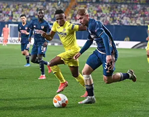 Arsenal's Emile Smith Rowe Clashes with Villarreal's Samuel Chukwueze in UEFA Europa League Semi-Final
