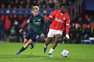 PSV Eindoven V Arsenal 2023-24 Prints: Arsenal's Emile Smith Rowe Closes In on PSV Eindhoven's Isaac Babadi in UEFA Champions League Clash