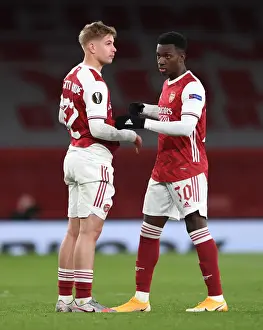 Arsenal's Emile Smith Rowe and Eddie Nketiah Celebrate Semi-Final Advancement vs. Villarreal in Empty Emirates Stadium