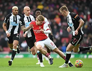 Arsenal's Emile Smith Rowe Faces Off Against Newcastle's Shelvey and Krafth in Premier League Clash