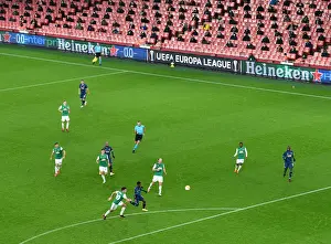 Arsenal's Emirates Stadium: A Ghostly Arena in Europa League Match against Rapid Wien (December 2020)