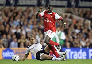 Tottenham Hotspur V Arsenal - Carling Cup 2010-11 Prints: Arsenal's Emmanuel Eboue and David Bentley Clash in Intense Carling Cup Rivalry: Arsenal 4-1 Tottenham (AET)