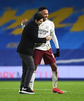 Arsenal's Empty-Stadium Triumph: Arteta and Aubameyang Celebrate Over Brighton in the Premier League (2020-21)