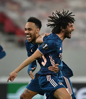Olympiacos V Arsenal 2020-21 Prints: Arsenal's Europa League Victory Amidst Empty Stands: Elneny and Aubameyang Celebrate Goals in Karaiskakis Stadium