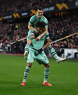 Stade Rennes V Arsenal 2018-19 Prints: Arsenal's Europa League Victory: Unforgettable Goal Celebration between Iwobi and Xhaka