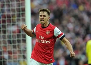Images Dated 12th April 2014: Arsenal's FA Cup Triumph: Ramsey's Thrilling Goal vs. Wigan Athletic