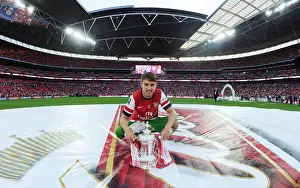 Arsenal's FA Cup Victory: Aaron Ramsey Lifts the Trophy after Defeating Hull City