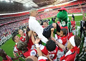 Arsenal's FA Cup Victory: Arsene Wenger and the Jubilant Squad Celebrate at Wembley Stadium