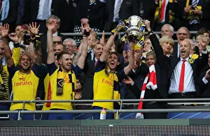 Arsenal's FA Cup Victory: Arsene Wenger and Nacho Monreal Celebrate with the Trophy (2015)