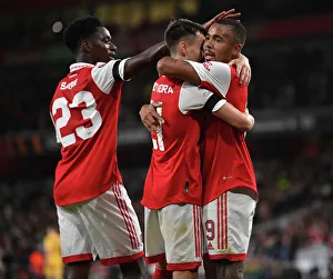 Arsenal's Fabio Vieira, Gabriel Jesus, and Albert Sambi Lokonga Celebrate Goals Against FK Bodo/Glimt in Europa League Match