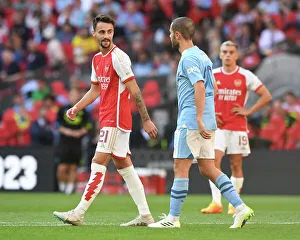 Arsenal's Fabio Vieira and Manchester City's Bernardo Silva Engage in a Chat Amidst Community Shield Tension (2023-24)