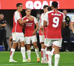 Arsenal's Four-Goal Blitz: Trossard & Kiwior Celebrate vs. FC Barcelona (Pre-Season 2023-24)