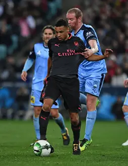 Arsenal's Francis Coquelin Clashes with Sydney FC's David Carney in Pre-Season Friendly
