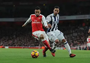 Arsenal's Francis Coquelin Fends Off West Brom's Nacer Chadli in Premier League Clash