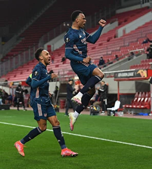 Images Dated 12th March 2021: Arsenal's Gabriel and Aubameyang Celebrate Empty-Stadium Goals in Europa League Match vs. Olympiacos